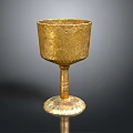 Golden Engraved Cup With Stemmed Base And Ornate Design For Household Use