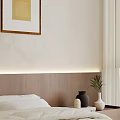 Modern Bedroom With White Bedding Wooden Headboard Framed Wall Art Large Window And Scenic View