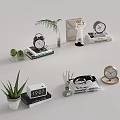 Different Types of Clocks on Books with Green Plants and Decorative Figurines
