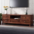 Wooden TV Stand With Yellow Flower Vase Candle And Dry Branches On Top