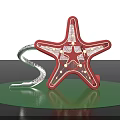 Decorative Red Starfish With Grid Light Bulbs And Silver S Shaped Object On Green Platform
