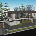 Modern Guesthouse Building With Large Glass Windows Surrounded by Grassland and Trees