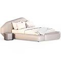 Modern Beige Double Bed With Curved Headboard Pillows Blanket And Side Table
