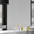Modern Kitchen Black Sink With White Marble Countertop And Faucet Water Flow