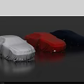 Three Covered Cars In Light Blue Red Dark Blue On Smooth Black Surface
