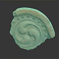 Intricate Spiral Stone Sculpture With Circular Carved Patterns And Textured Surface