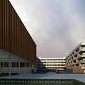 Modern School Campus With Teaching Buildings Sports Ground Running Track And Green Spaces