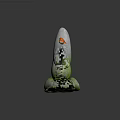 Small Orange Bird Perched On Artfully Stacked Greenish Stones Against Dark Background