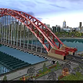 Aerial Planning of Red Arch Bridge With City Night View And River Illumination