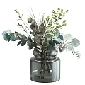 Elegant Transparent Glass Vase With Green Gray Blue Foliage Arrangement