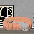 Peach Button tufted Sectional Sofa With Gray Blanket Decorative Ball And Black White Abstract Painting
