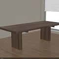 Dark Wooden Dining Table With Thick Legs On Wooden Floor Near Window And Plant