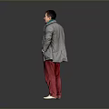 Man Standing With Hands In Pockets Wearing Gray Coat Green Scarf And Red Pants