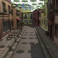 Colorful Buildings Lined Street With Hanging Green Umbrellas Stone Paved Path And Outdoor Tables Chairs