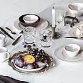 Elegant Tableware Set Including Bowls Plates Mugs Crystal Glasses and Fruit Decorations