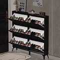 Black Multitier Shoe Rack in Entryway with Door Mat Holding Shoes and Decorative Lamp Frames