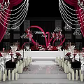 Banquet Hall Decorated For Wedding Party With Pink Floral Decor Chandeliers And Petals
