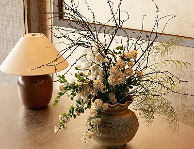 Natural Ceramic Vase With White Flowers Green Foliage And Slender Branches On Tabletop Indoor Setting 3d model