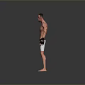 UFC Fighter Standing In Octagon With Black Gloves And White Shorts