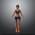Woman in Black Sports Bra and Shorts Standing Against Grey Background