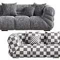 Black Sectional Sofa with Multiple Black Cushions and White Accent Pillows in Modern Leather Design