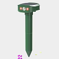 Green Pole Device With Red Indicator Lights On Top Structure