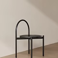 Black Console Table With Arched Metal Frame And Round Top In Minimalist Design