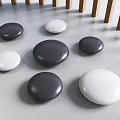 Pebble Shaped Black And White Circular Landscape Seats On Ground With Wooden Fence