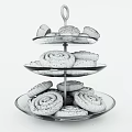 Freshly Baked Cinnamon Rolls on Three Tiered Glass Stand with Mini Pastry Buns