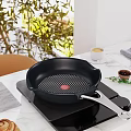 Kitchen Island With Marble Countertop Frying Pan Induction Cooktop Coffee And Green Plants