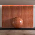 Brown Wooden Wall Panel With Natural Wood Grain And Round Wooden Sphere On Dark Floor