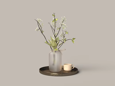 Transparent Glass Vase with Small White Flowers Green Branches on Round Tray and Small Cup 3d model