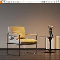 Beige Upholstered Accent Chair With Metal Frame And Side Table With Candles And Open Books