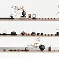 Traditional Tea Set Collection On Wooden Shelves With Teapots Teacups And Decorative Plants