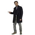 Man in dark coat gray pants brown shoes pointing to side with light brown background