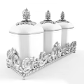 Three Glass Spice Jars with Decorative Lids on Ornate Metal Stand Containing Dried Spices