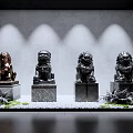 Showcase Featuring Lion Statues on Marble Pedestals Gray Wall Spotlight White Pebbles And Green Foliage
