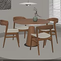 Modern Minimalist Round Wooden Dining Table With Four Chairs Green Plant And Pendant Light