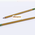 Two Golden Pencils With Green Accents Placed On White Background Surface