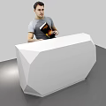 White Geometric Reception Desk With Man Standing Behind Holding Book