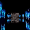 Elevator Hallway With Illuminated Commercial Text On Walls And Ceiling Creating Modern Vibe