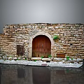 Ancient Stone Building Featuring Arched Wooden Door And Rough Stone Walls