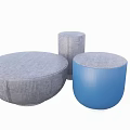 Round Gray And Blue Textured Upholstered Ottomans For Modern Living Room