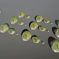 Green And White Decorative Stone Pieces With Colorful Lines And Small Ornaments