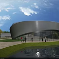 Modern Curved White Sports Stadium with Glass Walls Waterfront Green Lawn Under Blue Sky