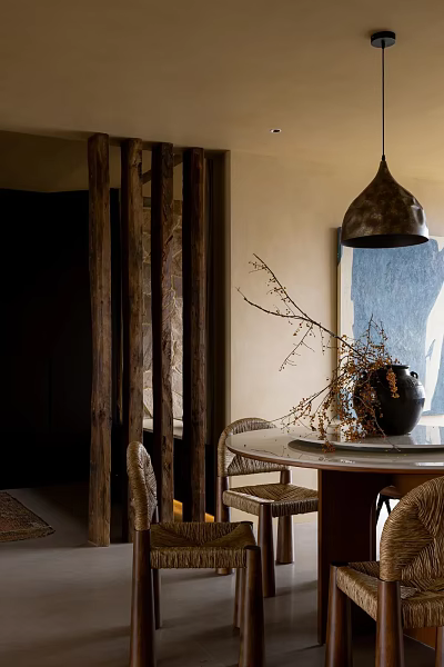 Restaurant Interior Featuring Wooden Beams Woven Partition Round Dining Table Wicker Chairs and Pendant Lamp 3d model
