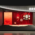 Traditional Decorative Display Area With Red Backdrop Fan And Wall Artworks