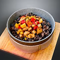 Delicious Black Rice Bowl with Chicken and Colorful Vegetables on Wooden Board
