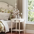 Elegant White Double Bed with Carved Headboard Floral Bedding and Decorative Pillows