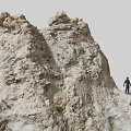 Stone and Wood Rocky Formation with Human Figure Standing on Natural Structure